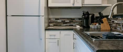 Fridge, microwave, stovetop, coffee/tea maker