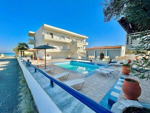 Seasonal outdoor pool, pool loungers, lifeguards on site