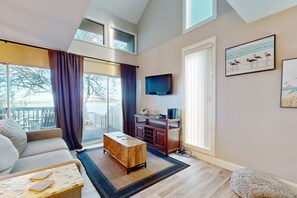 TV, fireplace - Waterfront townhome with AC, WiFi, private dock, & shared pool - near beach (Corpus Christi)