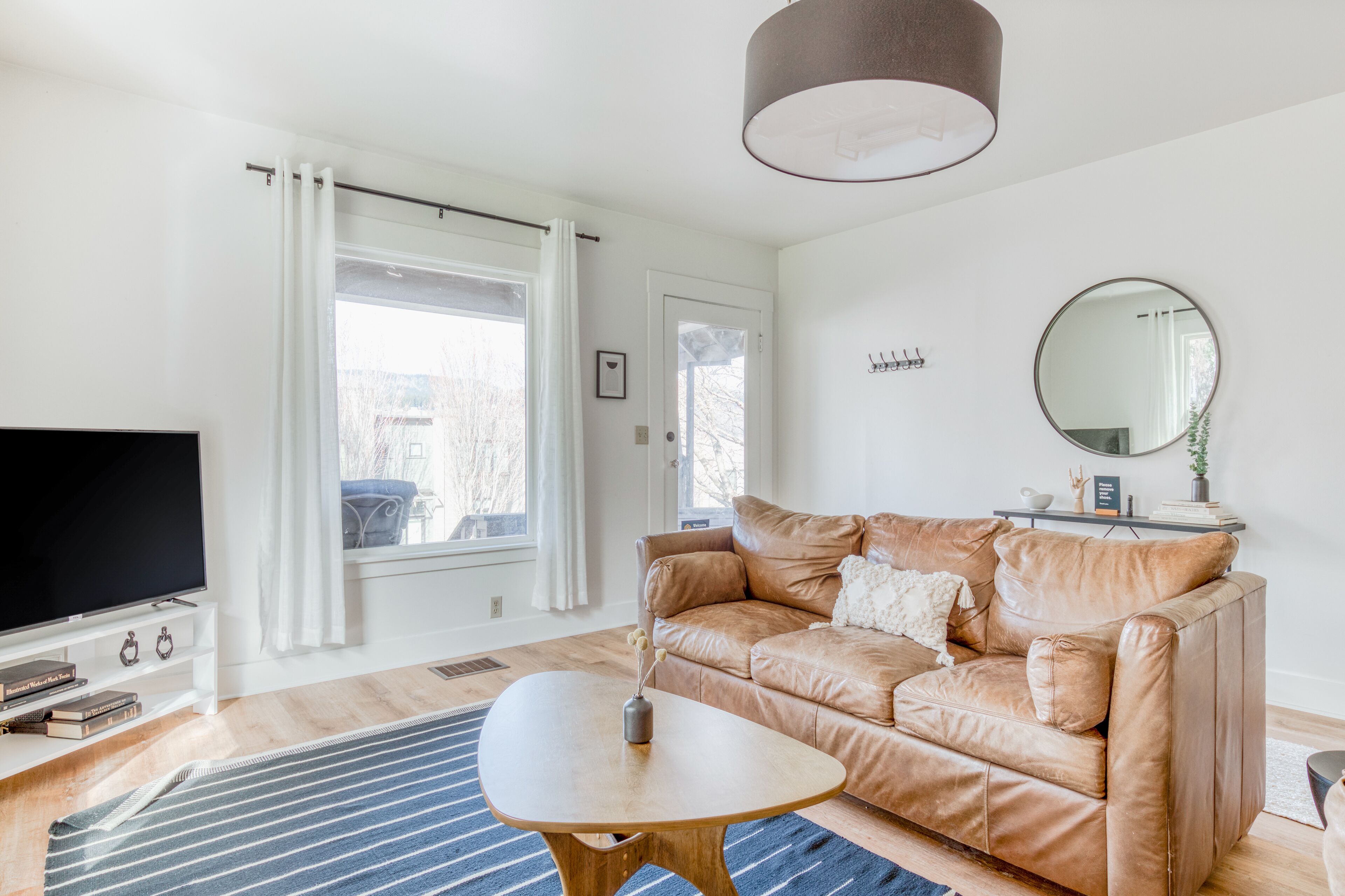 Stylish home with shared hot tub and patio, walkable locale, WiFi, & W/D