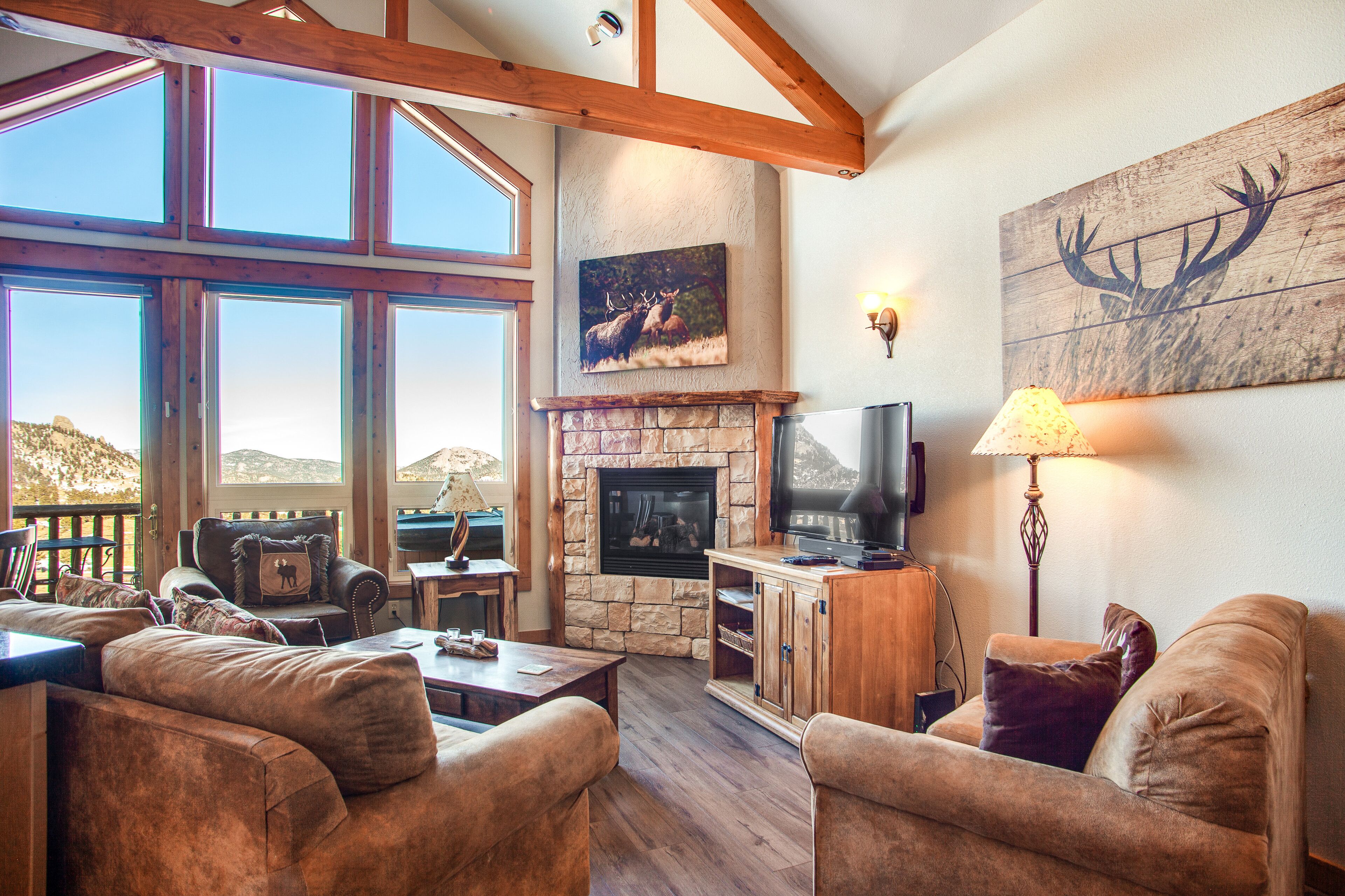 Two-story mountain view condo with deck, hot tub, two gas fireplaces, and A/C