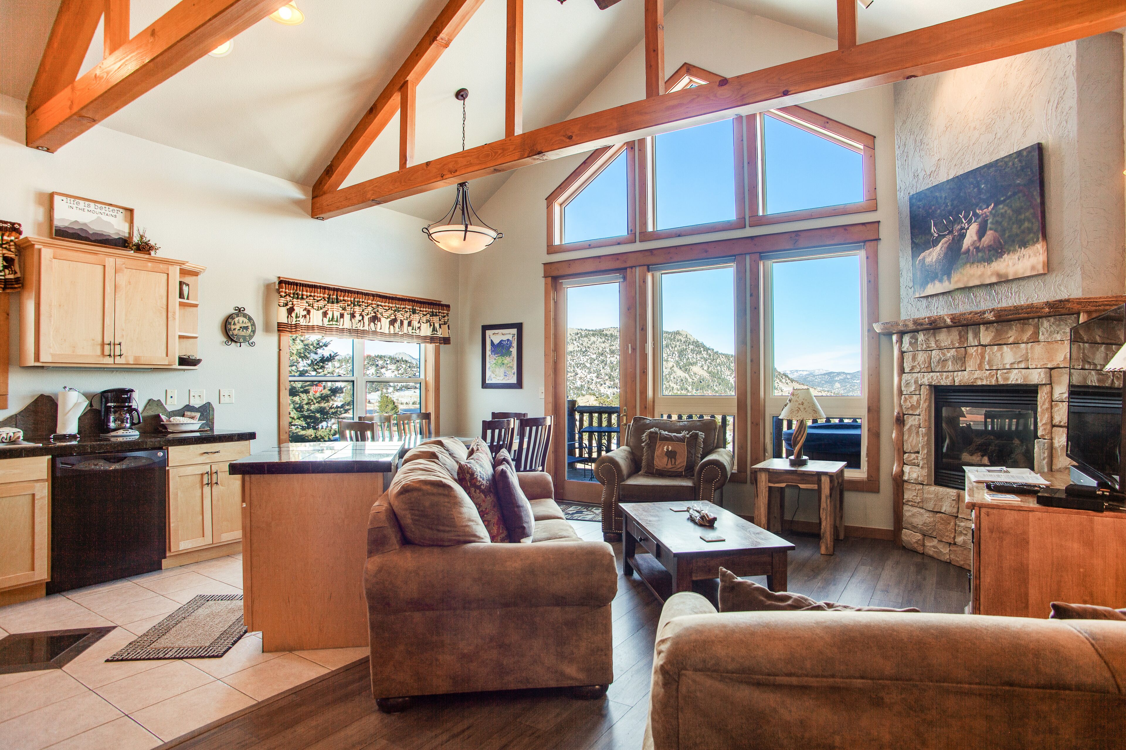 Two-story mountain view condo with deck, hot tub, two gas fireplaces, and A/C