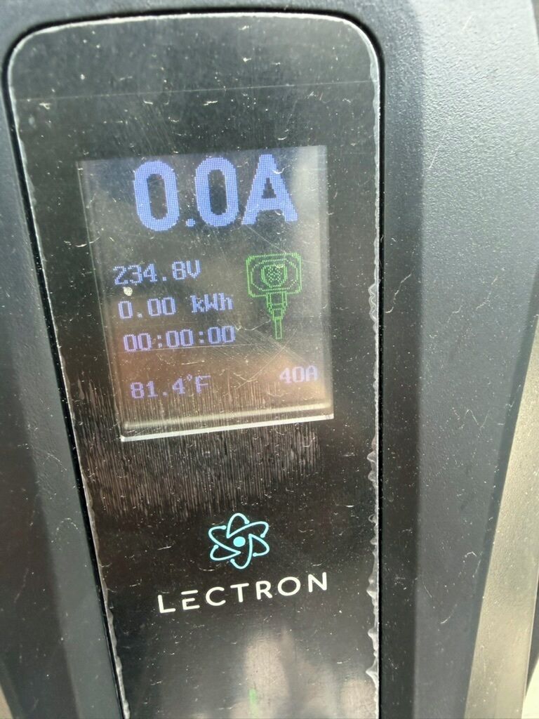 A digital display with readings: 0.0A, 234.8V, 0.00 kWh, 81.4°F, and 40A.