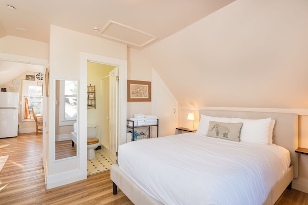 Queen bed and attached bathroom.