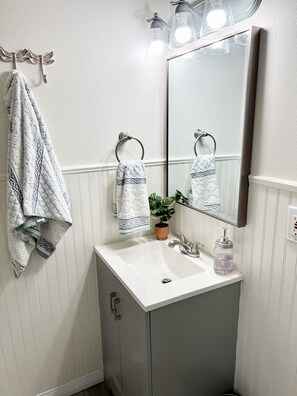 Shower, hair dryer, towels, soap