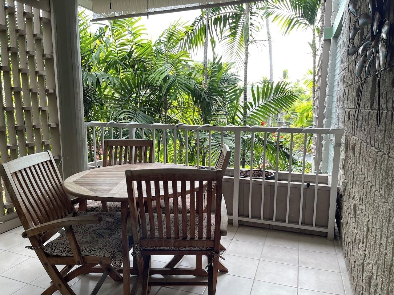 Private lanai surrounded by tropical greenery — ideal for morning coffee or evening relaxation.