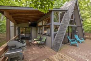 A wooden deck with outdoor seating and a grill. - The Innsbrook Oasis Pt. III by Innsbrook Vacations! (Wright City)
