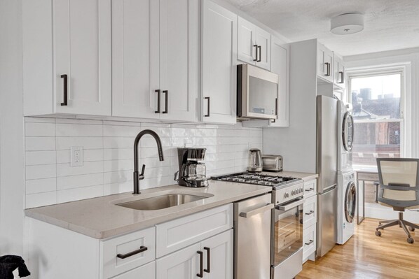 Fridge, microwave, oven, stovetop - Modern North End 2BR w/ W/D on Salem St., near dining, by Blueground (Boston)
