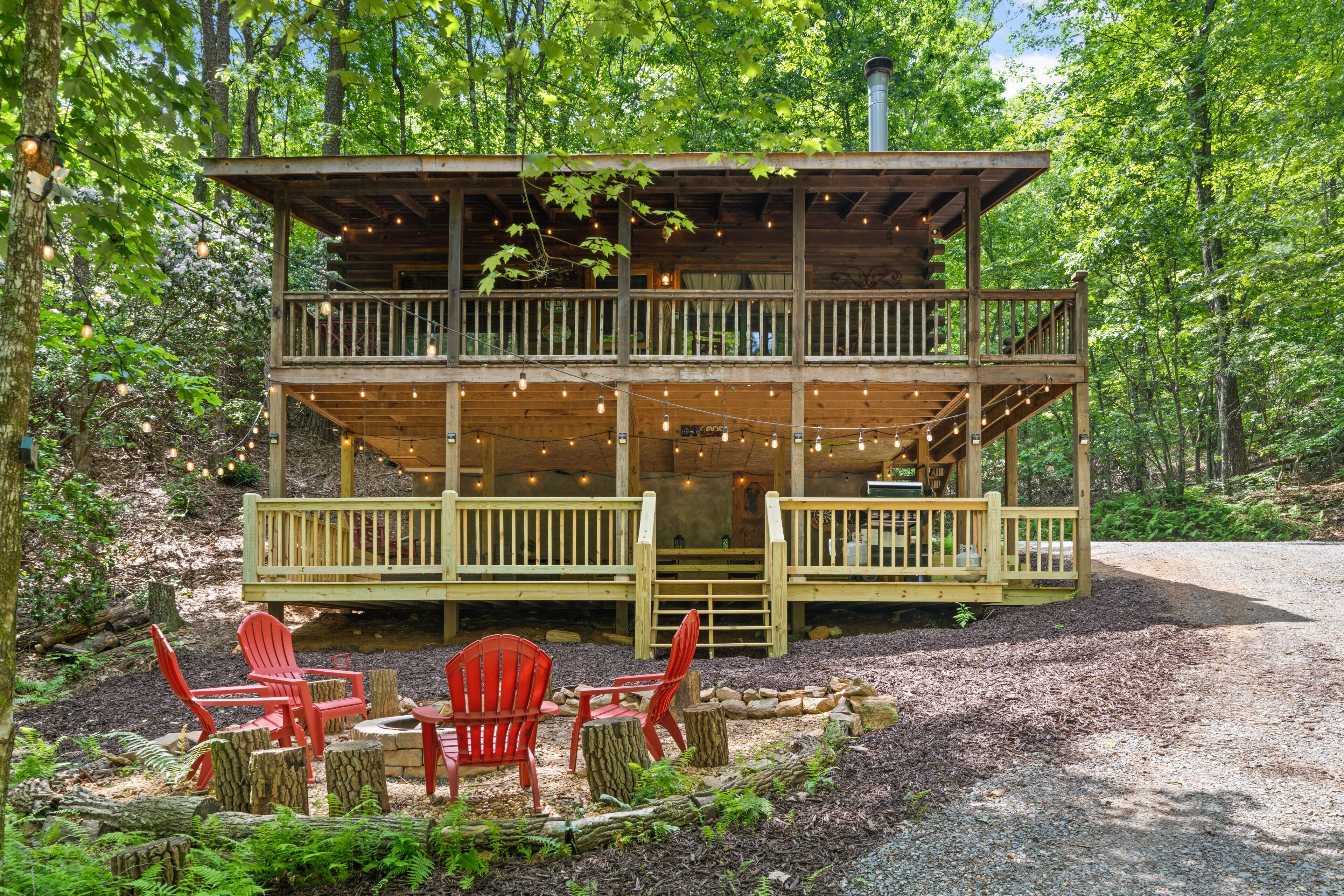 Dog-friendly country cabin with deck, fireplace, firepit, & seasonal lake view