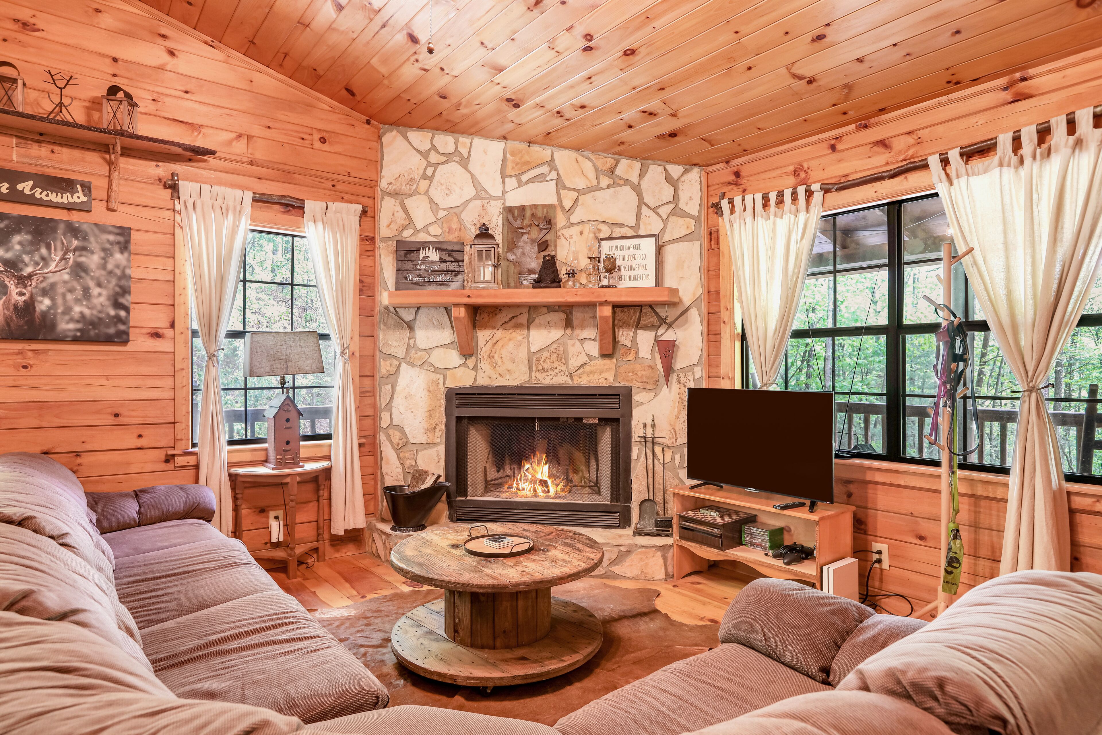 Dog-friendly country cabin with deck, fireplace, firepit, & seasonal lake view