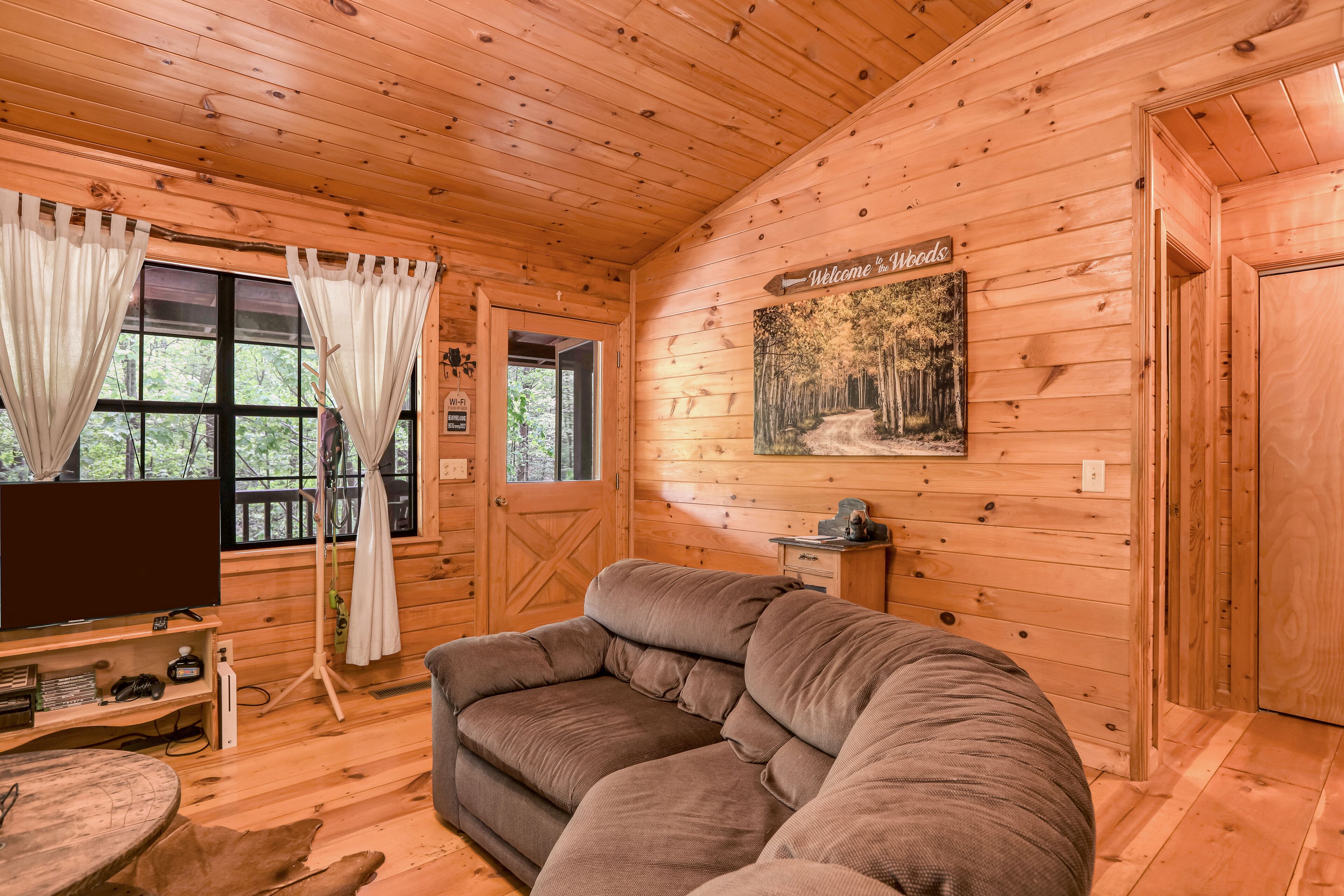 Dog-friendly country cabin with deck, fireplace, firepit, & seasonal lake view