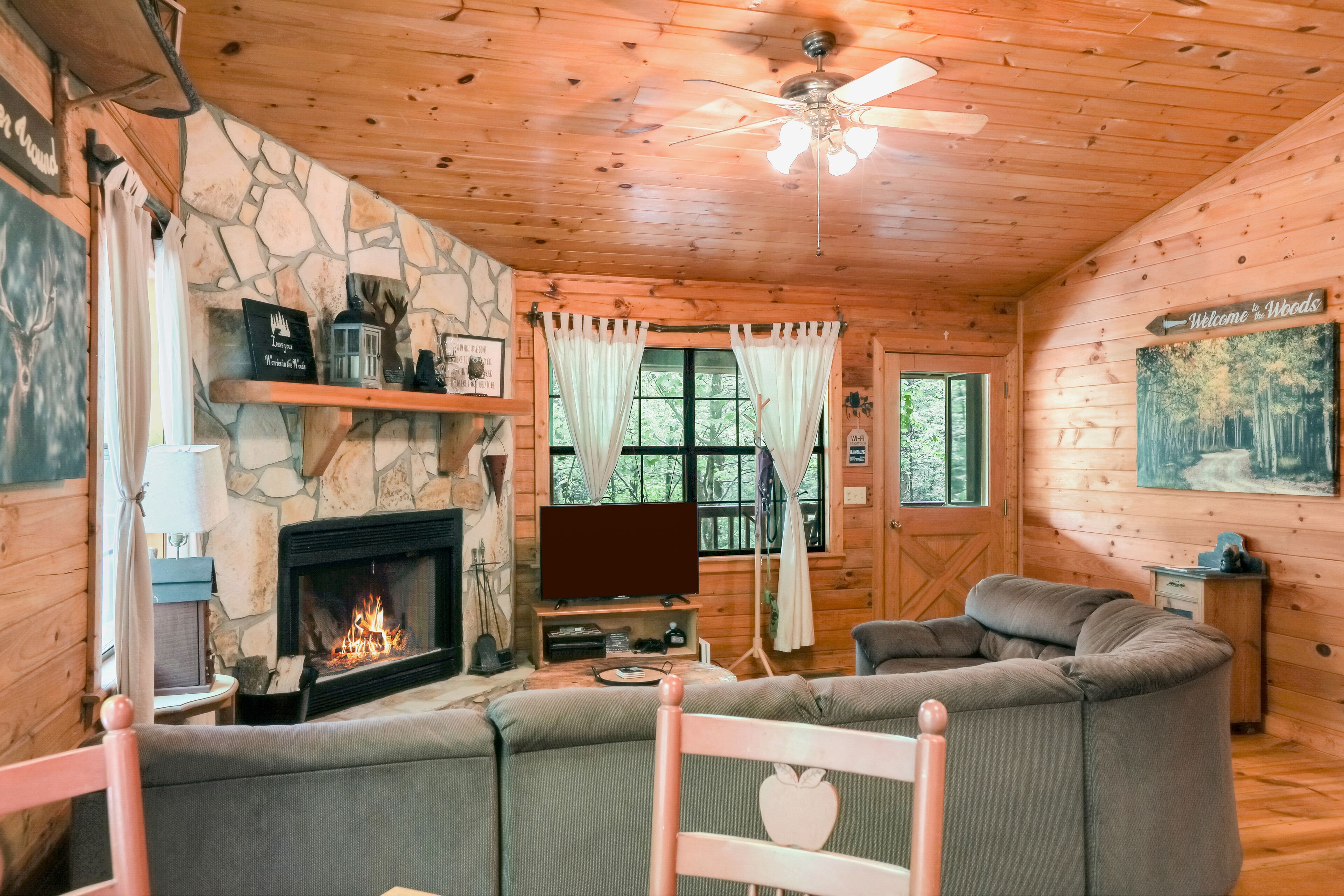 Dog-friendly country cabin with deck, fireplace, firepit, & seasonal lake view