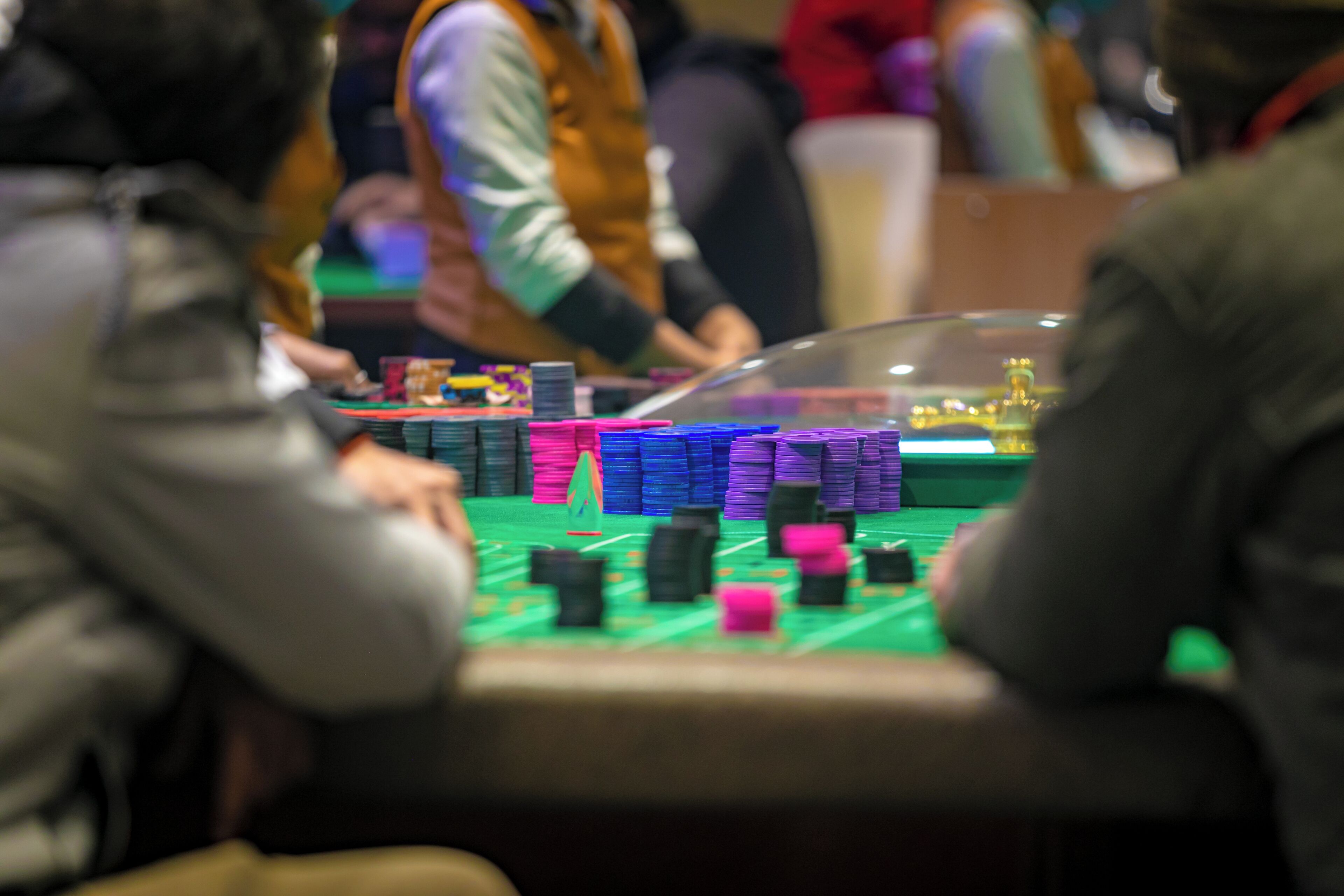 A casino table with stacks of poker chips.