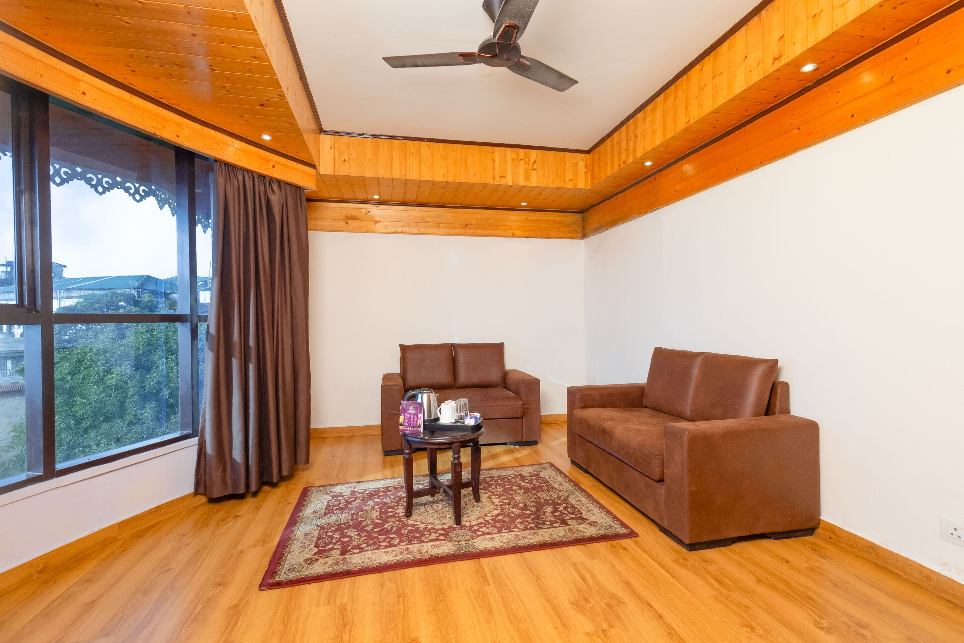 Family Quadruple Room | Living area | 32-inch Smart TV with satellite channels, TV