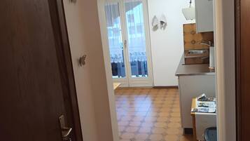 Fridge, stovetop, dishwasher, coffee/tea maker