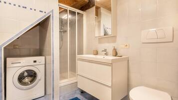 Bathtub, hair dryer, towels