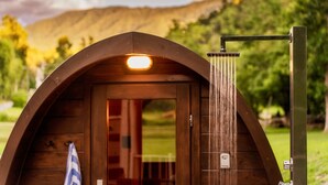 A wooden cabin with a shower and a door. - Heated Pool, Sauna & Easy Access Near Gatlinburg (Sevierville)