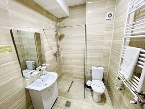 Shower, hair dryer, towels, soap