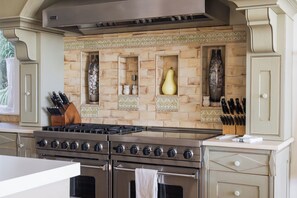 Fridge, dishwasher, coffee/tea maker, cookware/dishes/utensils
