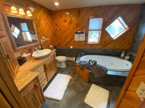 Bathtub, jetted tub, towels, soap