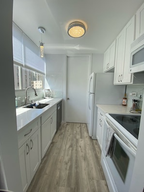 Fridge, microwave, oven, stovetop - Remodeled oasis in the heart of Waikiki! Min. from beach, shops, & restaurants! (Honolulu)