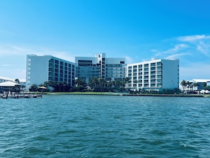 Enjoy waterfront views from the hotel's balconies, overlooking the surrounding greenery and dock.