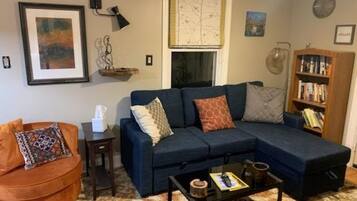 Smart TV, fireplace, books, printers