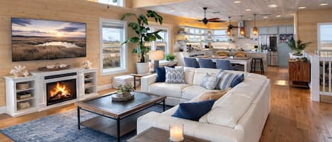 Smart TV, chimenea, libros, estéreo