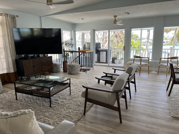 Smart TV, fireplace, books, printers