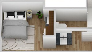 Een moderne slaapkamer met een bed, nachtkastje en een kleine potplant.