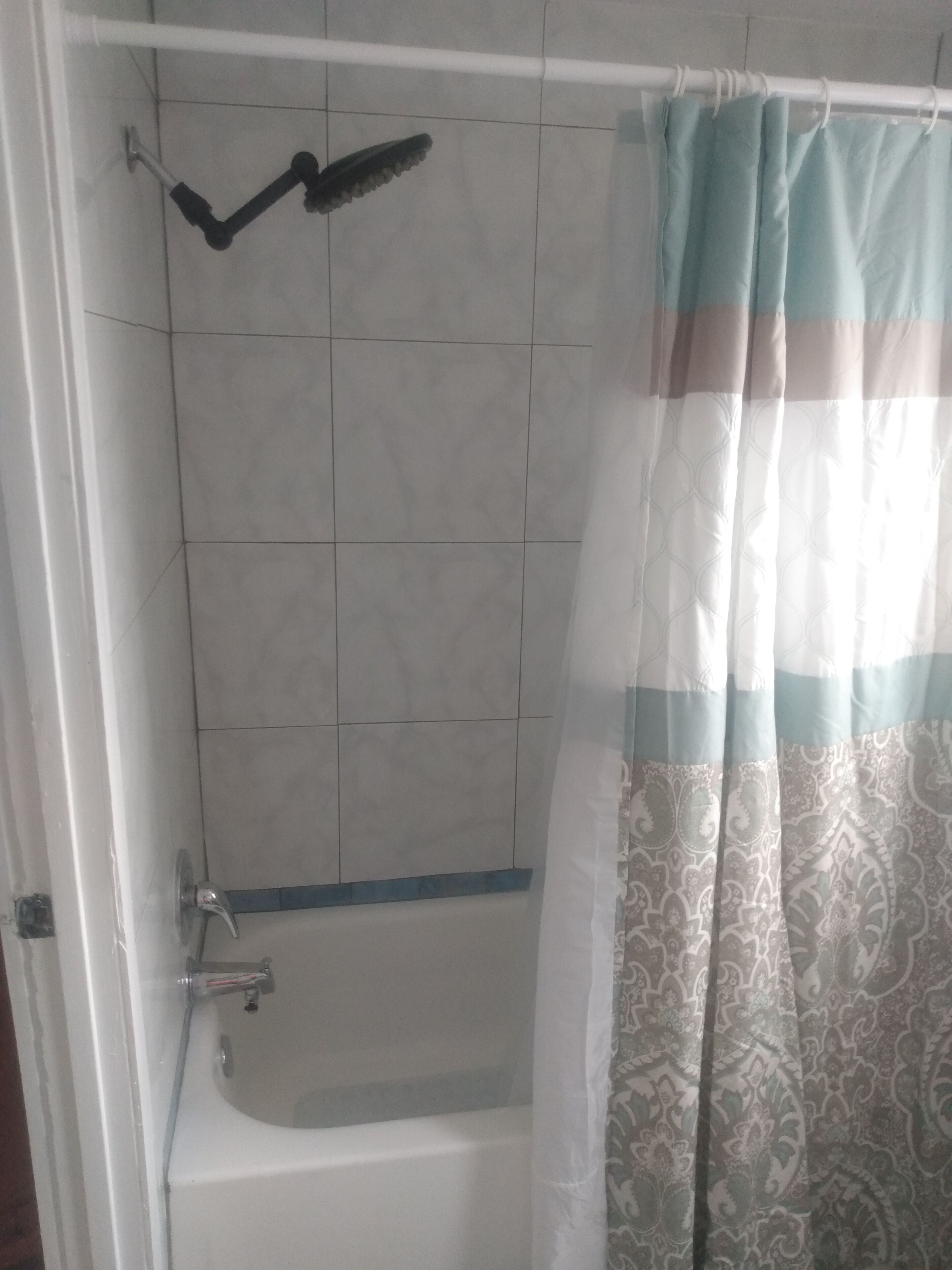 Bathtub, hair dryer, towels, soap