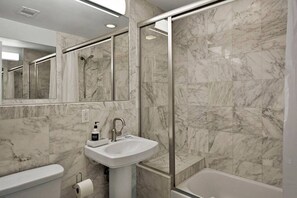 Combined shower/tub, hair dryer, towels, soap
