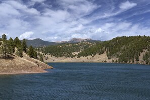 A lake surrounded by forested hills and mountains. - Page 1-Mid-Century Modern With Mountain View (Victor)