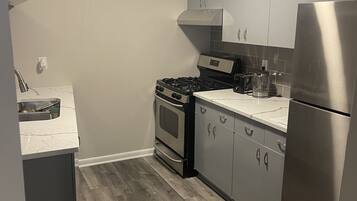 Fridge, stovetop, toaster, cookware/dishes/utensils