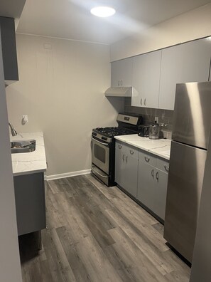 Fridge, stovetop, toaster, cookware/dishes/utensils