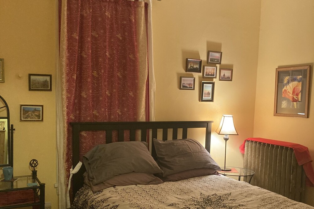 Private room in shared home with full kitchen, living room, and yoga space.