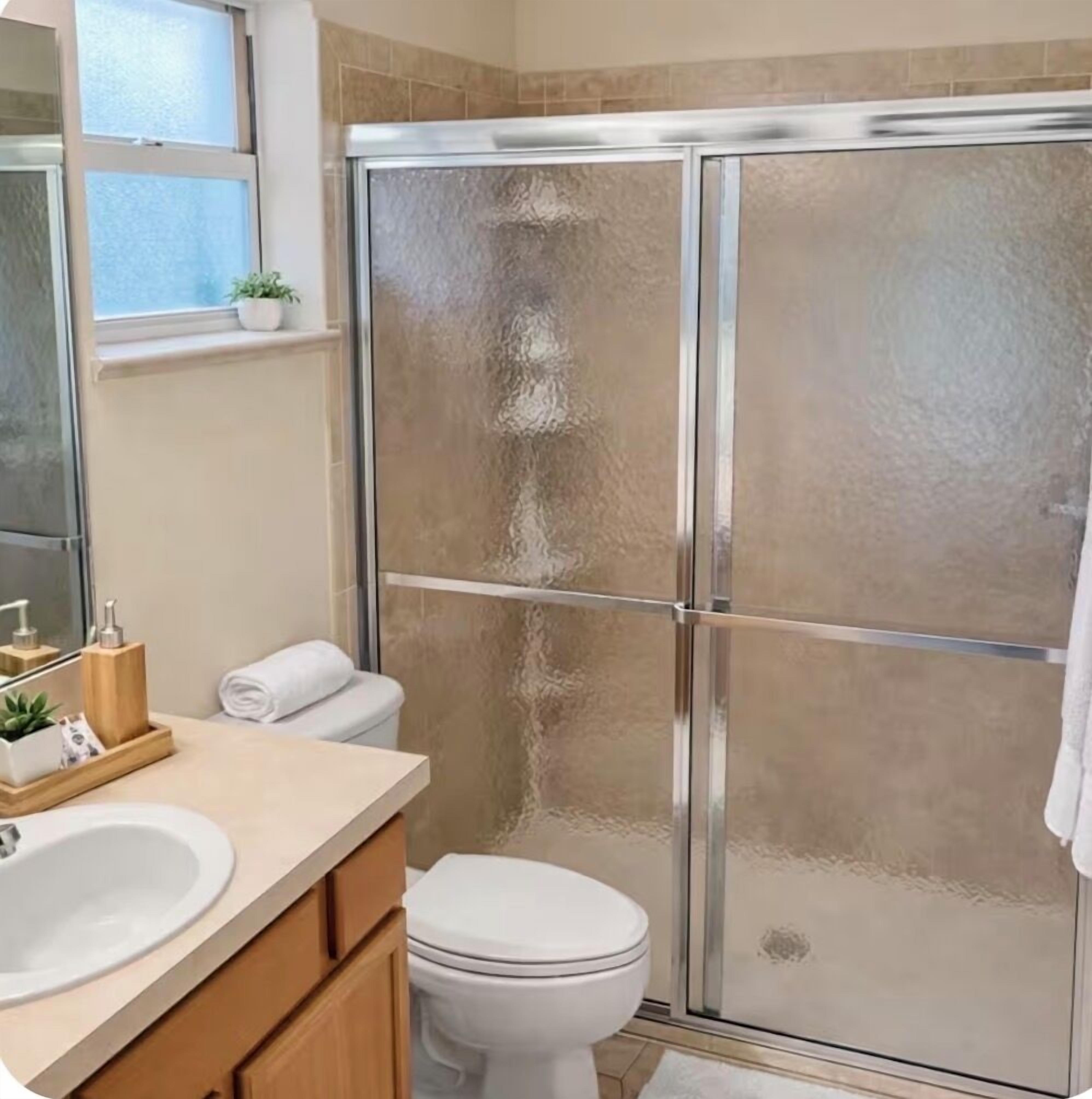 Combined shower/tub, hair dryer, towels, soap