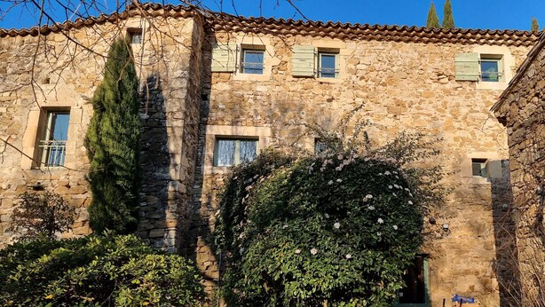 A stone building with multiple windows, some with shutters, and a small door. - Exceptional riverside estate 48 pers swimming pool private beaches (La roque sur ceze)