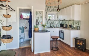 Fridge, microwave, coffee/tea maker, cookware/dishes/utensils