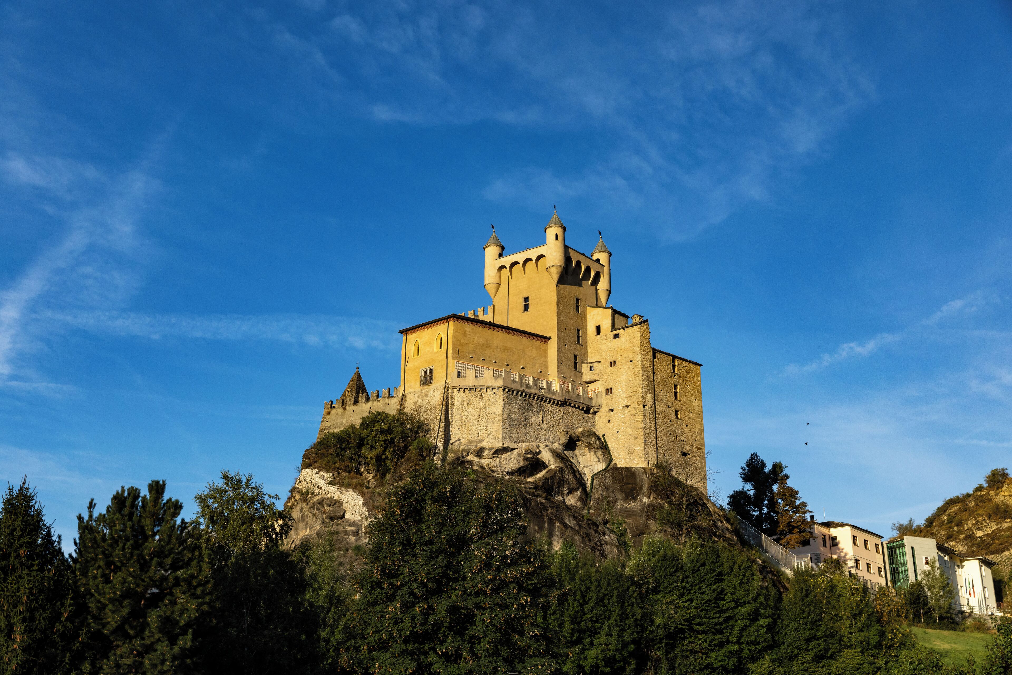 A castle on a hill with a clear sky.