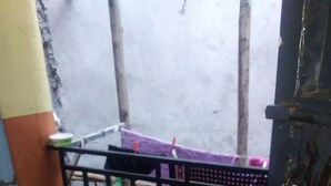 A small balcony with a tiled floor, a metal railing, and a purple cloth draped over the railing. - VIV HAVEN (Nairobi)