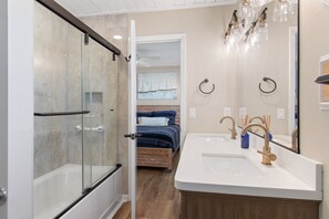 Combined shower/bathtub, hair dryer, towels - Fish On | 5BR Canal Home · Private Boat Dock · Golf Cart & Bikes Included (Ocean Isle Beach)