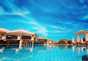 Seasonal outdoor pool, open 11:00 AM to 8:30 PM, pool umbrellas