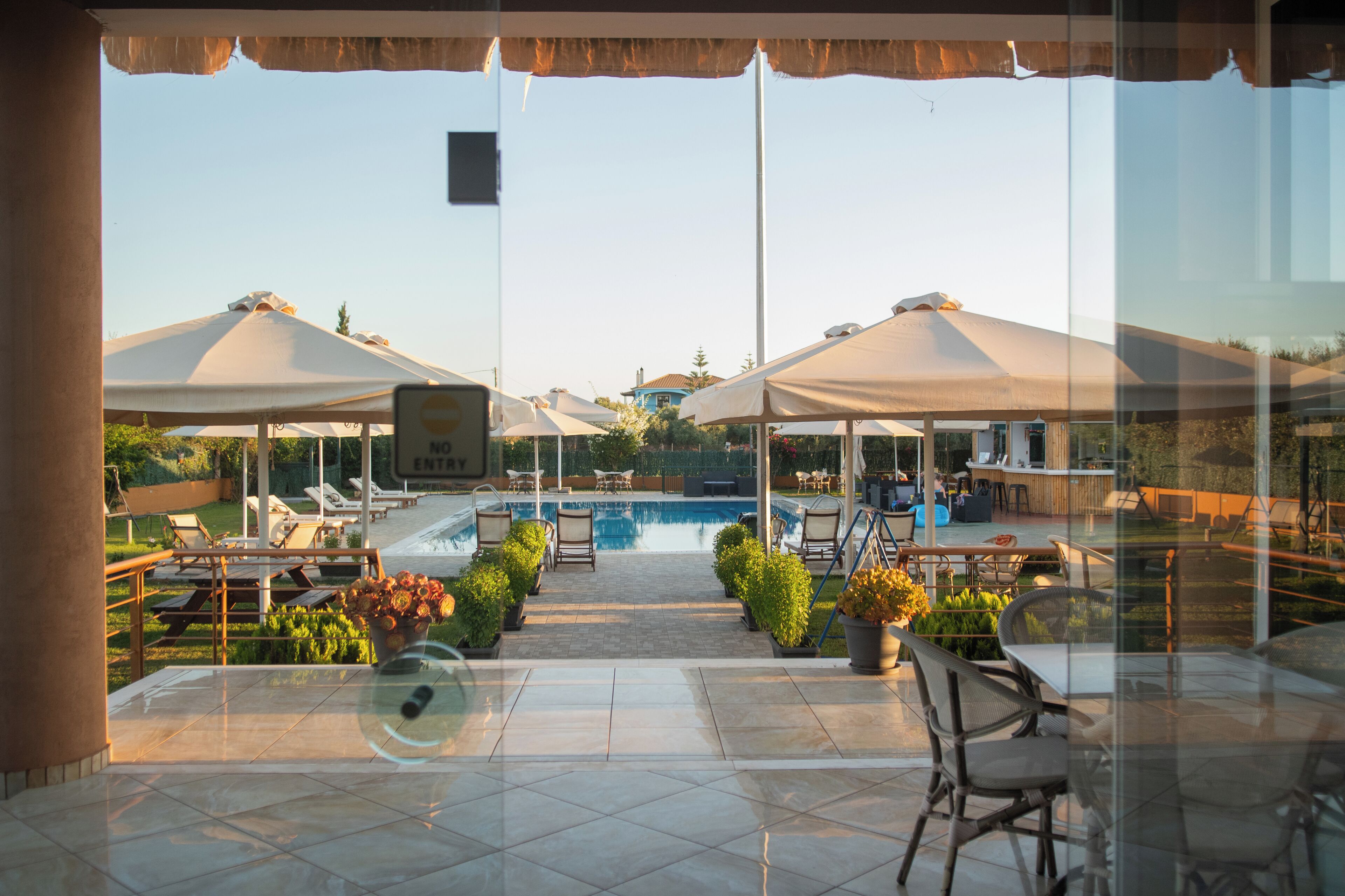 Seasonal outdoor pool, open 11:00 AM to 8:30 PM, pool umbrellas