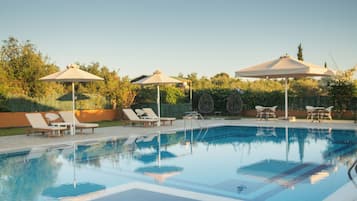 Seasonal outdoor pool, open 11:00 AM to 8:30 PM, pool umbrellas