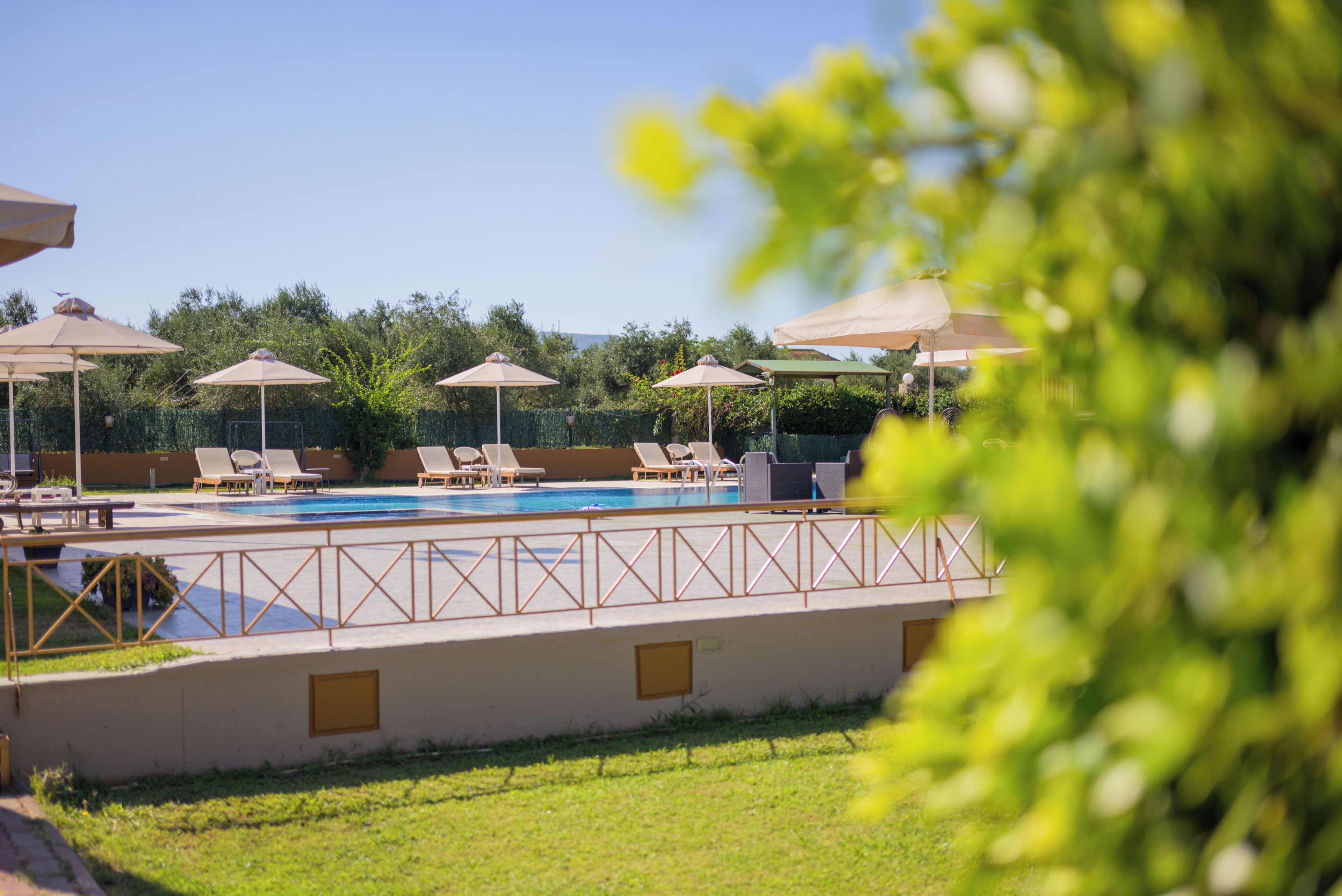 Seasonal outdoor pool, open 11:00 AM to 8:30 PM, pool umbrellas
