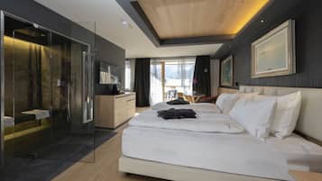 Premium bedding, down comforters, minibar, in-room safe