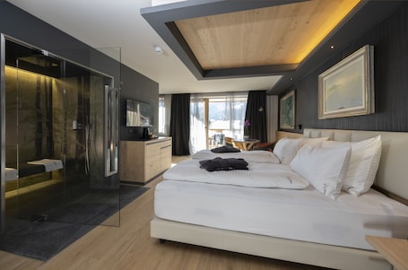 Premium bedding, down comforters, minibar, in-room safe