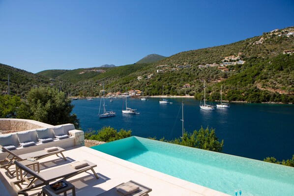 An infinity pool, pool loungers