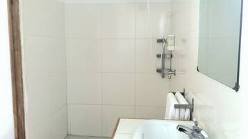 Shower, towels, soap, toilet paper